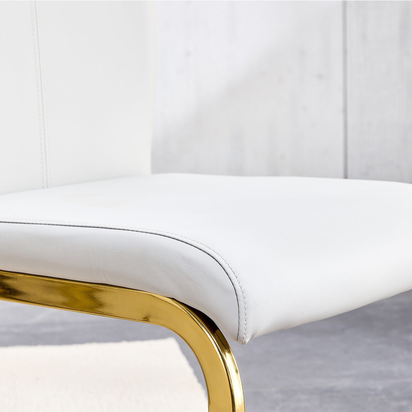 Melysen Table and Chair Set. 1 Table+4 White Pu Backrest Cushions with Gold Metal Leg Chairs . A Rectangular White Imitation Marble Desktop with Mdf Legs and Gold Metal Decorative Strips